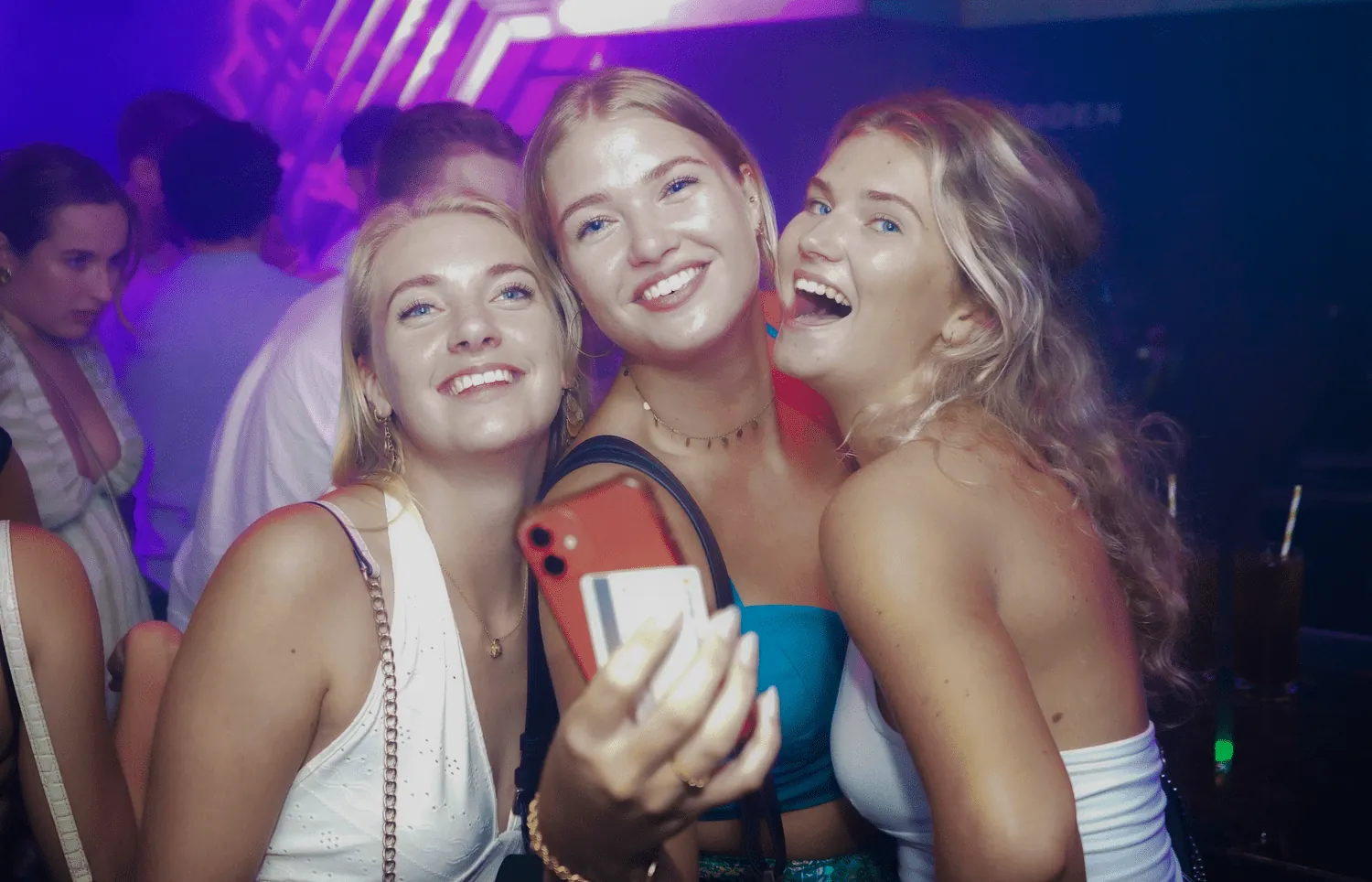 Three friends taking a selfie at a club night in Aruba