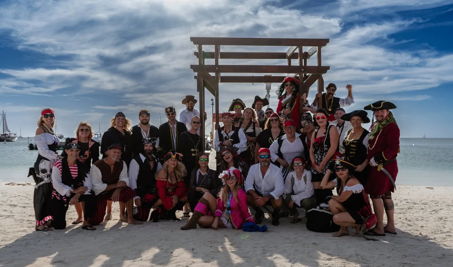 Group in pirate costumes on the beach in Aruba