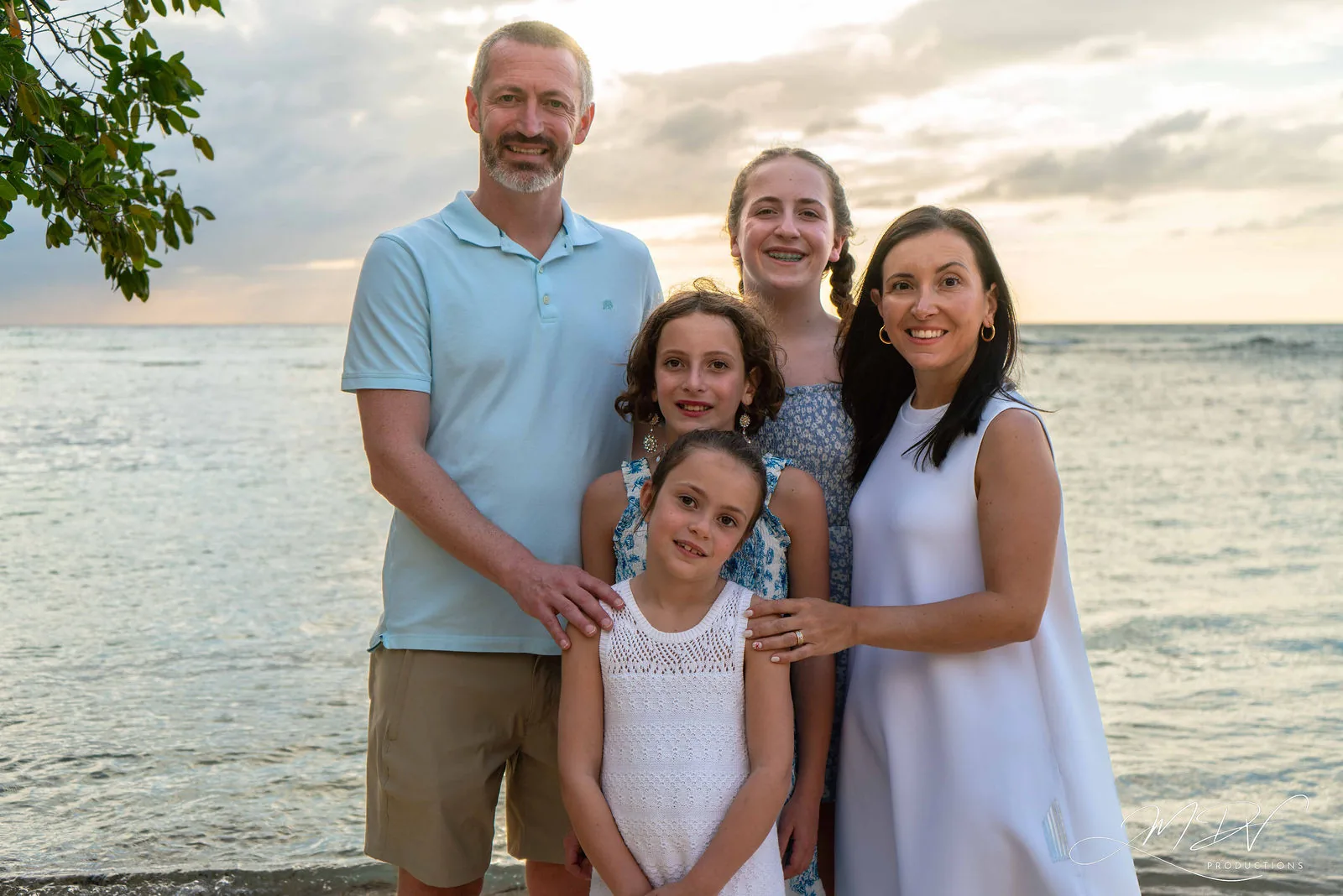 Parents with their three daughters by the sea in Aruba